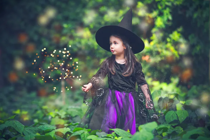 A child holding a wand, placeholder photo